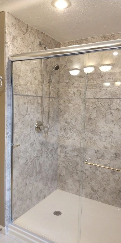 Hill bathroom renovation — acrylic shower enclosure with glass doors