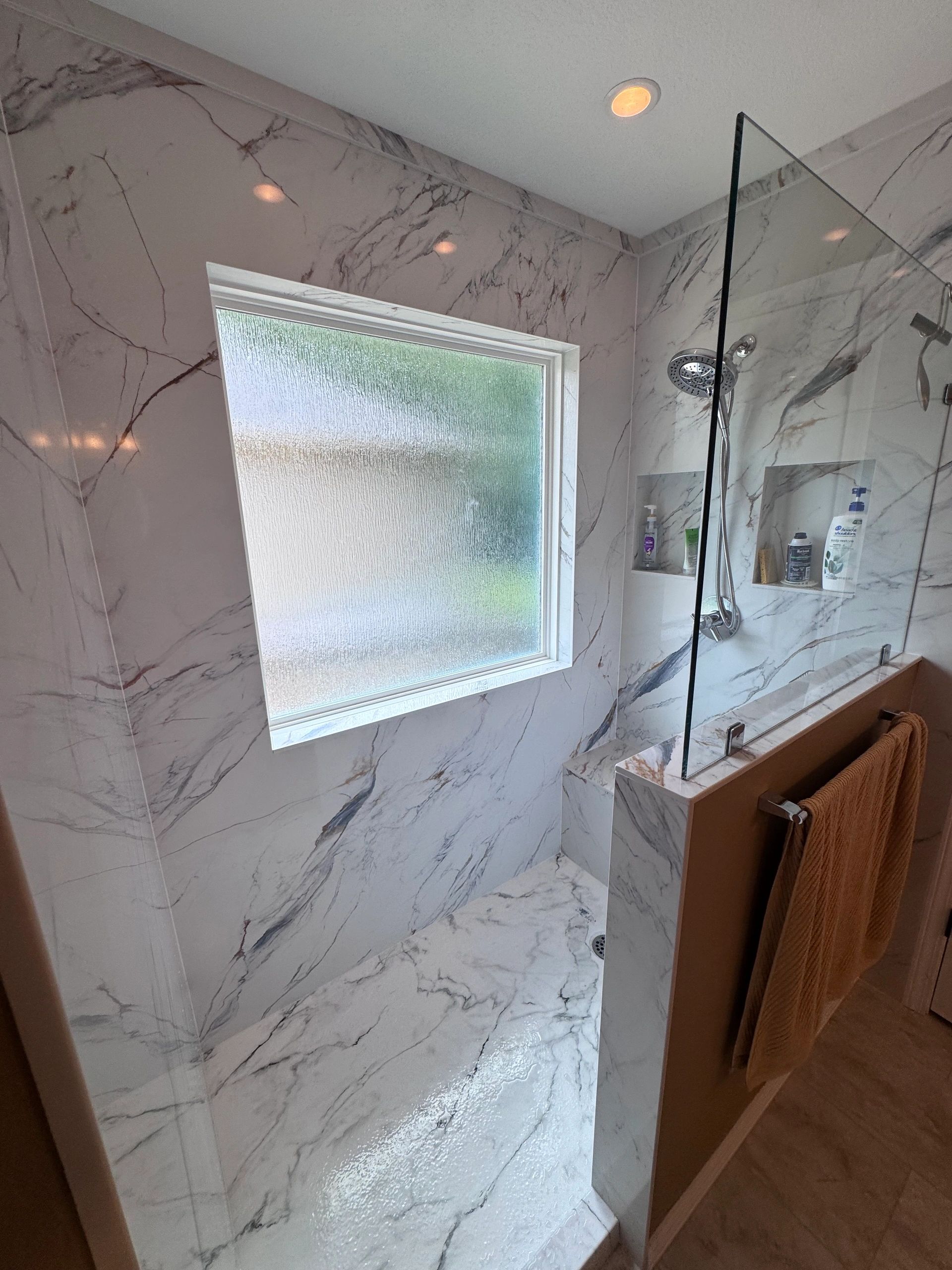 Premium shower remodel with marble tile